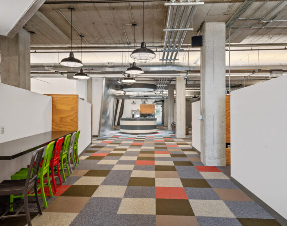 HPC's hallway with exposed ceiling and left side table and chairs