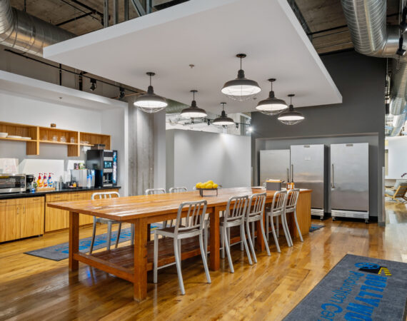 Kitchen and dining space with pipe ceiling