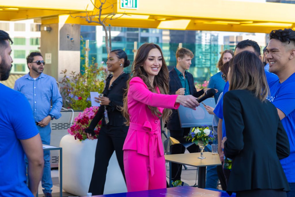 brightly dressed employee interviewing people