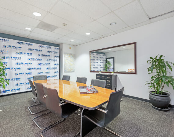 meeting room with a mirror and projector screen