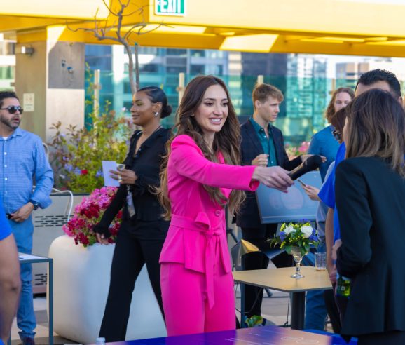 brightly dressed employee interviewing people